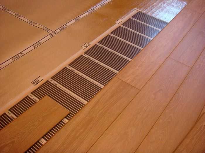 Теплый пол под ламинат на деревянный пол: какая система лучше и инструкция по монтажу